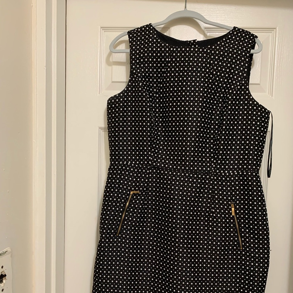 Stunning work dress... fits more like a 14